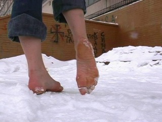 alena takes a barefoot walk in the winter city. part 3/3.