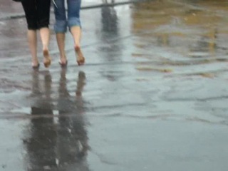 ira and zhenya walk barefoot through the cold city puddles. part 1/2.